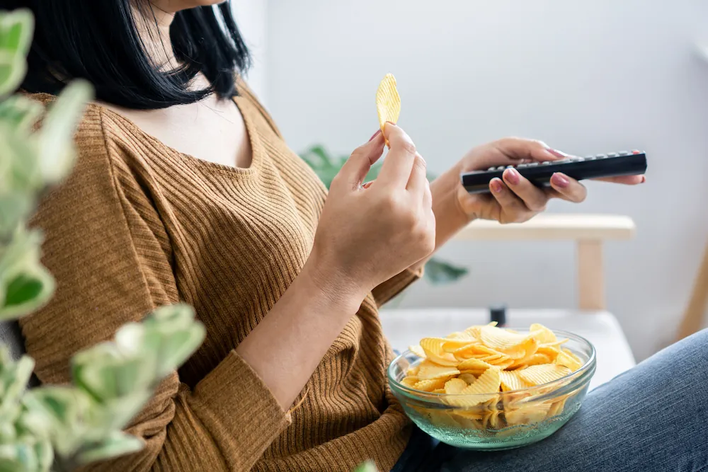 Woman eating chips