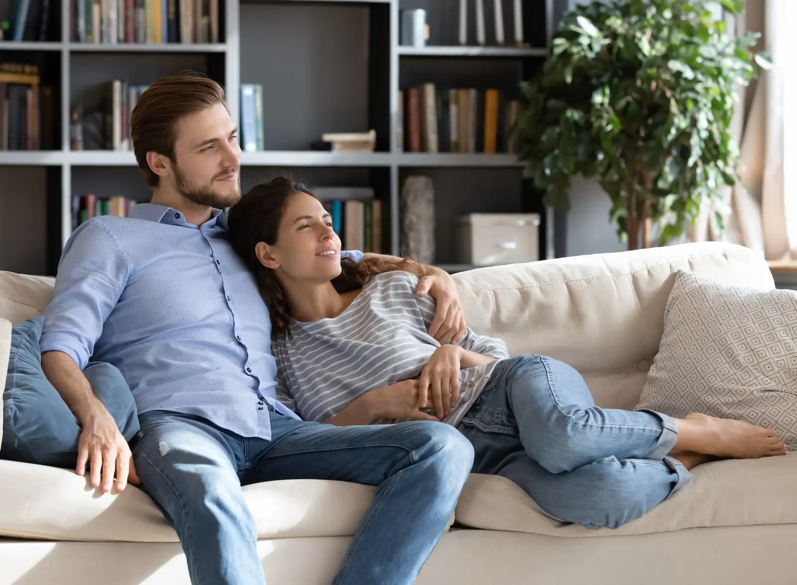 Young couple relaxing on couch