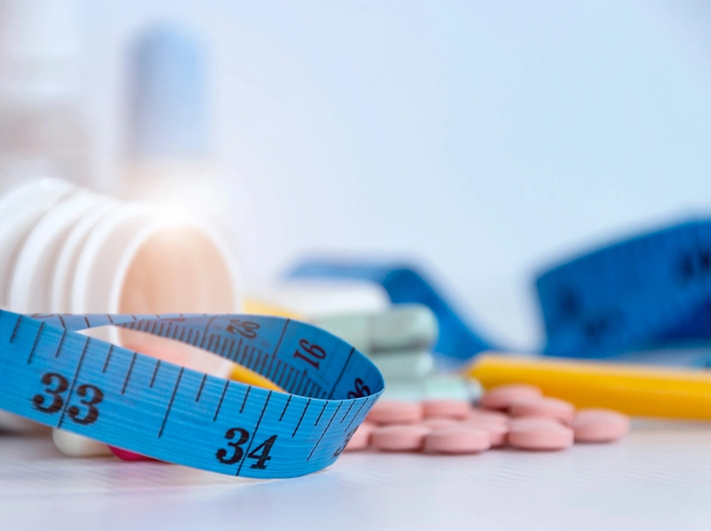 Measuring tape and weight loss prescription pills