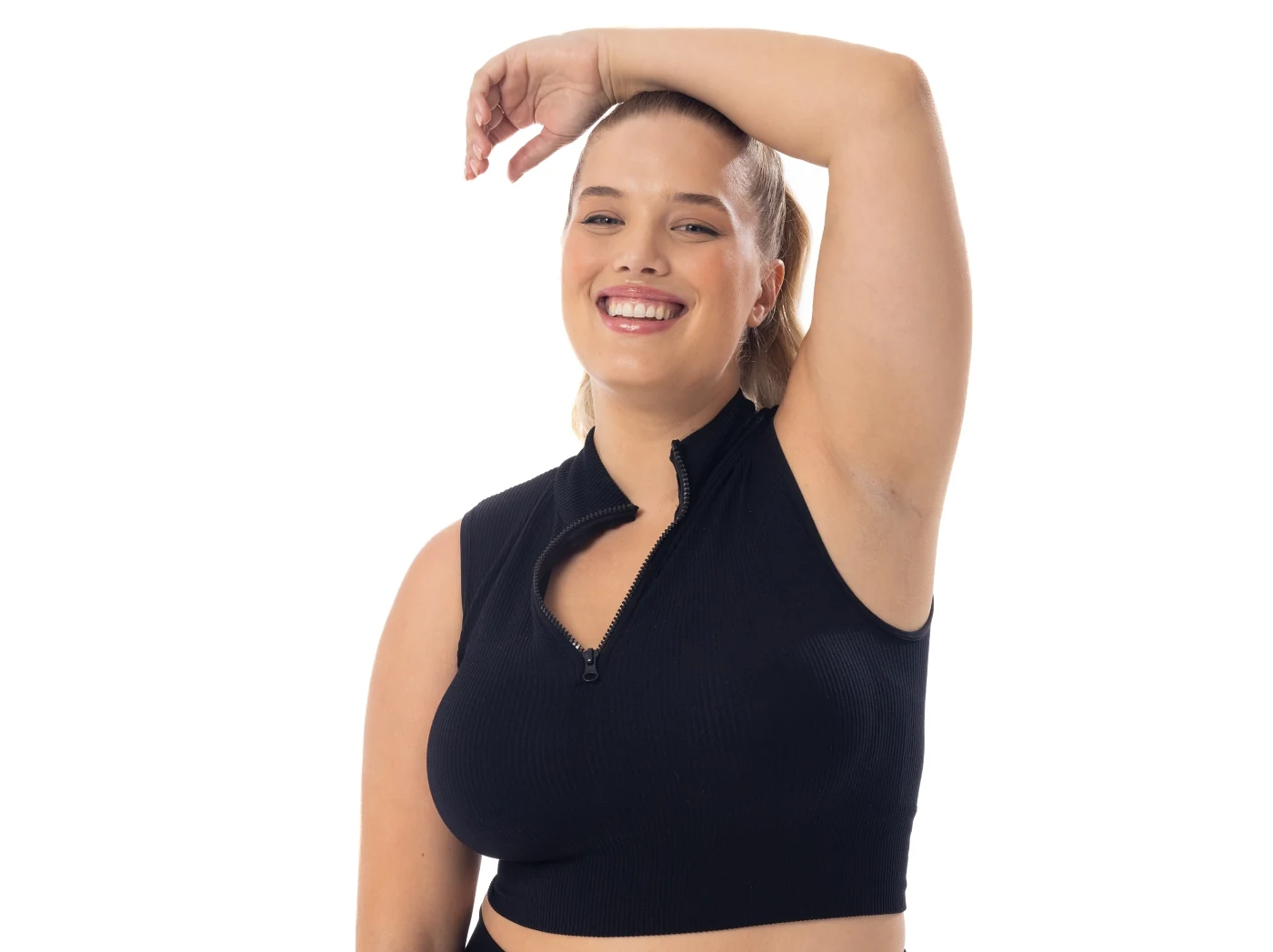 Woman confidently holding her arm up after hyperhidrosis treatment with Morpheus8