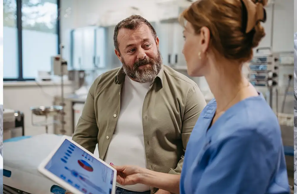 heavier middle aged man talking to doctor